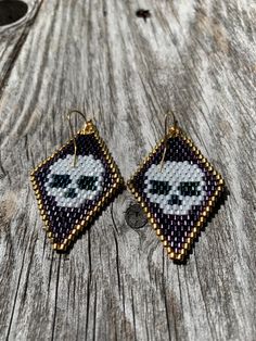 the beaded earrings are made to look like they have eyes on them, and one is