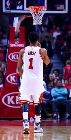 a basketball player is standing on the court