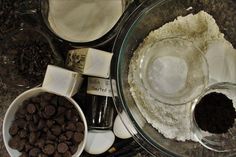 the ingredients for chocolate cake are in bowls