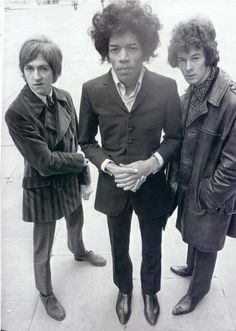 three young men standing next to each other