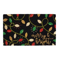 a merry and bright door mat with leaves on it