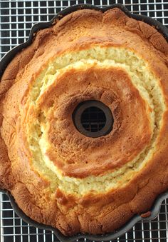 a cake that is sitting on top of a cooling rack with a bundt cake in it