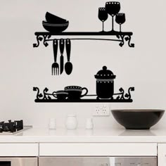 a kitchen wall decal with utensils and spoons hanging from the shelf