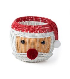 a white basket with a red nose and santa hat on it's head, sitting in front of a white background