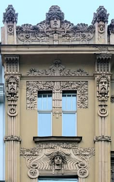 an old building with ornate carvings on the front