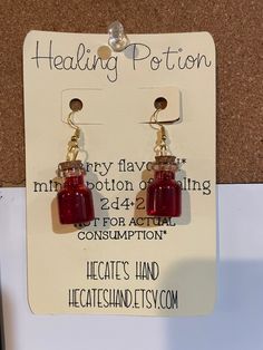 cherry flavored health potion* gives 2d4+2 HP Great gift or accessory for D&D players, Dungeon Masters, ttrpg,  Halloween, witchy folks, cosplay.   *NOT FOR ACTUAL CONSUPMTION* Cherry Flavor, Potion Bottle, Dungeon Master, Jewelry Earrings Dangle, Etsy Earrings, Dangle Drop Earrings, Dangle Earrings, Jewelry Earrings, Drop Earrings