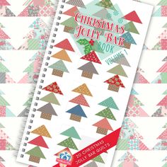 the christmas jelly bar book is open and on top of a colorful triangle pattern background