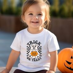 Get your little one ready for some spooky fun with our Trick or Treat Toddler T-Shirt! Made for Halloween, this shirt is perfect for your tot's trick or treating adventures. Let them join in on the fun and show off their festive spirit with our playful and comfy shirt! Halloween Shirts For Toddlers, Halloween Toddler Shirt, Playful Halloween T-shirt With Cartoon Print, Halloween Character Print Relaxed T-shirt, Comfy Shirts, Trick Or Treating, Trick Or Treat, Little One, Festival