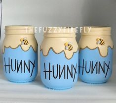 three painted jars with the words hummy hummy on them are sitting next to each other