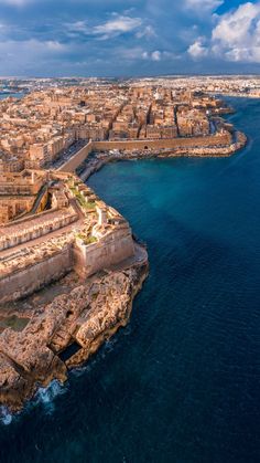 an aerial view of the old city and its surrounding seawalls, taken from above