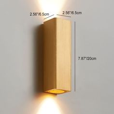 a wall light with two lights on each side and measurements for the width in front of it