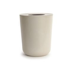 a white cup sitting on top of a table