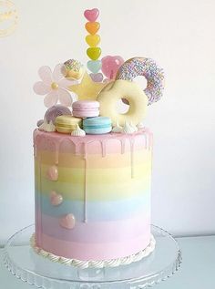 a cake decorated with doughnuts, donuts and candy