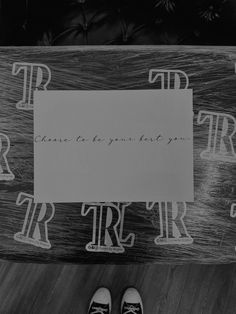 black and white photograph of someone's feet on a skateboard with the words trust to your best friend