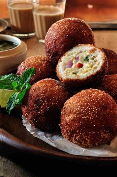 some food is sitting on a plate and ready to be eaten with sauces in the background