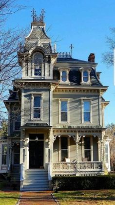 an old victorian style house with many windows