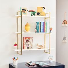 there is a book shelf with books on it