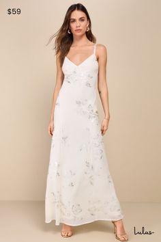 Your beauty will wow wherever you go in the Lulus Blissfully Graceful Ivory Floral Metallic Backless Maxi Dress! Lightweight woven chiffon boasts an elegant, metallic floral print as it shapes slender straps that tie across the open back. Bodice has a V-neckline and a flattering waist, atop a slip-style skirt finishes at a maxi hem. Fit: This garment fits true to size. Length: Ankle length. Size medium measures 58.5" from adjustable straps to hem. Bust: Great for any cup size. Waist: Loosely Fitted. Hip: Loosely Fitted. Undergarments: May be worn with an adhesive bra, petals, or no bra. Fabric: Fabric has no stretch. Lined. Shell: 100% Polyester. Lining: 97% Polyester, 3% Spandex. Hand Wash Cold. Do Not Bleach. Line Dry. Iron Low Heat. Imported. Lulus | Blissfully Graceful Ivory Floral Met Ivory Floral Dress, White Garden Dress, White Beachy Dresses, Rehearsal Dinner Outfit Bride, Bride Rehearsal Dinner Outfit, White Dresses Classy, Off White Gown, Bridal Fits, White Dresses Long