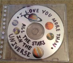 a cd with the words, i love you more than stars and planets on it