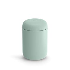 a light green round container with a lid