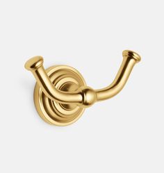 an image of a gold robe hook on a white background with clipping for text