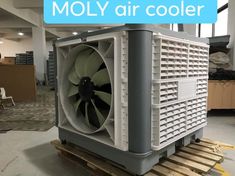 a large air cooler sitting on top of a pallet