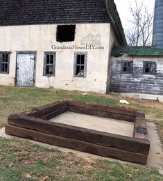 an old building with a wooden box in front of it