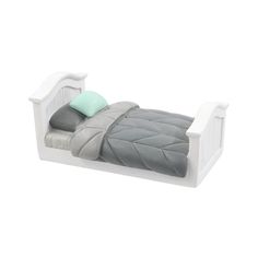 a white bed with grey and green pillows on it's sides, in front of a white background