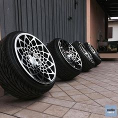 four tires are lined up on the ground