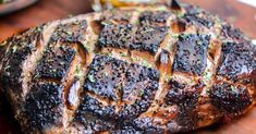 a close up of a steak on a cutting board