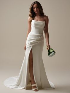 a woman in a white dress holding a bouquet