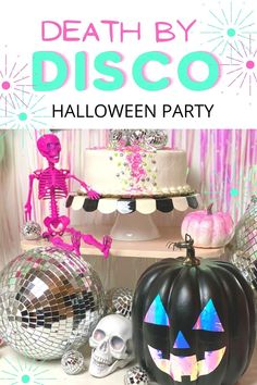 a table topped with halloween decorations and disco balls