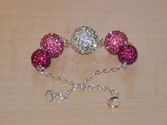 jewelry Pink Beads, Disco Ball, Belly Button Rings, Different Colors, Hot Pink, Diamond Earrings, Jewelry Bracelets, Bracelet, Solid Color