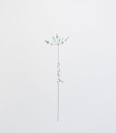 a drawing of a single flower with the word love written in cursive writing