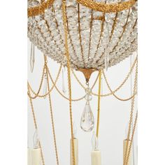 a chandelier hanging from the ceiling with crystal beads and chains on it's sides