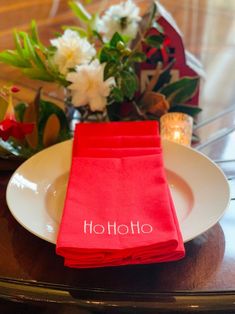 red napkins sitting on top of a white plate