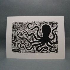 an octopus is depicted in this black and white print on paper, with swirls around it