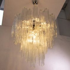 a glass chandelier hanging from the ceiling