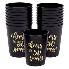 black and gold cheers to 50 years cups with gold foil lettering on the side, set of 12