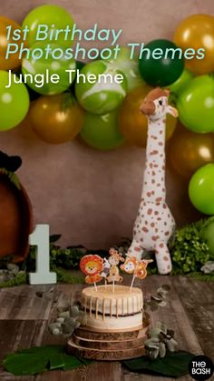 a giraffe cake topper sitting on top of a wooden table next to balloons