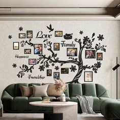 the family tree wall decal is shown in this living room with green couches