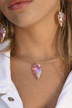 Another version of our most-loved gold choker with arrowhead pendant, this Pink Aura necklace is the most beautiful pink choker! Wear this with our beautiful Heart Work Earrings (as seen in photos) and remember that your "Heart Work" is to be authentically you. Wear this beauty with their matching Pink Aura Earrings as seen in photos. Pink Aura Quartz connects to all of the body's Chakras. It holds a potent, dynamic energy that uplifts, enhances, and brings out your true essence. Pink Aura Quart Pink Choker Jewelry For Festival, Unique Pink Jewelry For Festivals, Pink Bohemian Choker Jewelry, Pink Aura Quartz, Aura Necklace, Work Earrings, Arrowhead Pendant, Quartz Choker, Pink Choker