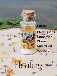 Healing spell jar photo with labels of what is inside- Citrine, clear quartz, Cinnamon, cloves, calendula, sea salt Healing Jar Witchcraft, Serenity Spell Jar, Spell Jar Gift Ideas, Solar Eclipse Spell Jar, Peace Of Mind Spell Jar, Healing Spells For Others Health Jar, Beginner Witch Spell Jars, Herbal Spell Jars, Spell Jars Witchcraft Aesthetic