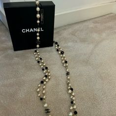 Chanel Faux Pearl And Cc Necklace In Gold/Black. Can Be Worn Long Or Wrapped Around For A Shorter Look. Features A Lobster Clasp Closure In A 24” Length. Comes With The Original Box. Chanel Pearl Necklace, Cc Necklace, Chanel Jewellery, Vintage Chanel Jewelry, Chanel Ring, Chanel Bracelet, Logo Necklace, Red Studs, Chanel Pearls