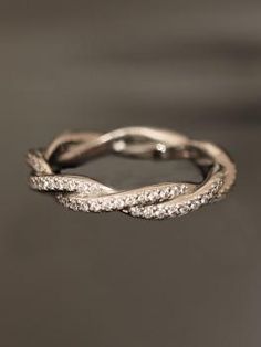 an image of a ring with diamonds on it