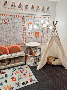 a child's room with a teepee tent, bookshelf and toys