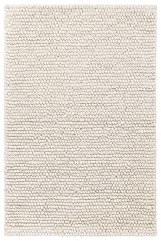 a white rug with wavy lines on it