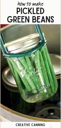 pickled green beans in a mason jar with text overlay