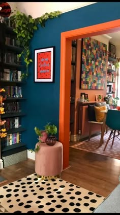 a living room filled with lots of furniture and decor