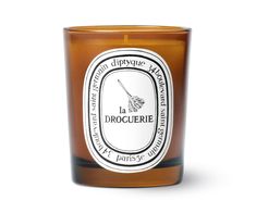 a glass candle that is brown and white with a label on the front saying, dippyquee